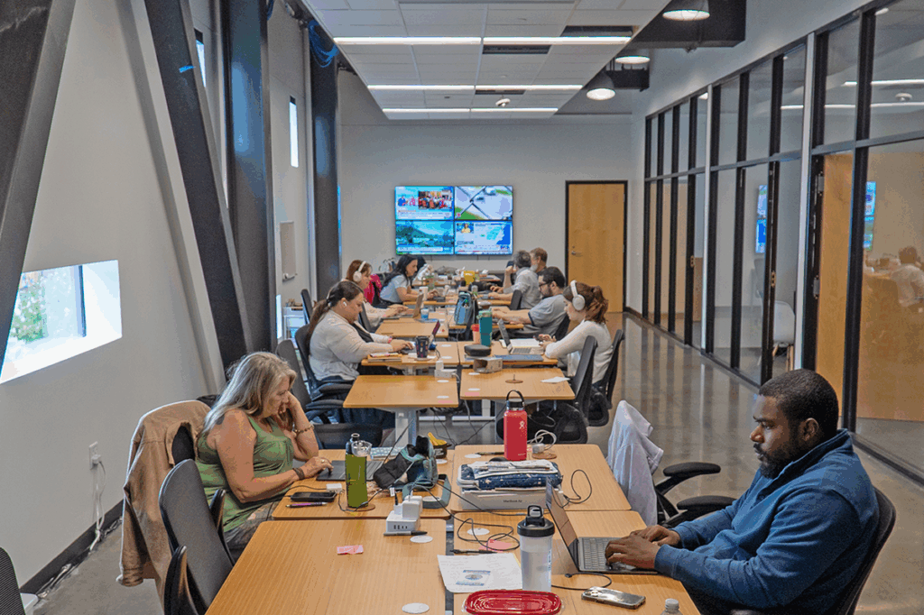 journalist  working in a large meeting room