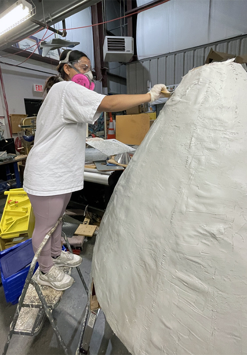 A UTulsa student works on the Space-Themed Interactive Kiosk